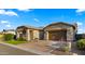 Charming home showcasing a well-manicured front yard and inviting entrance at 8149 E Jaeger St, Mesa, AZ 85207