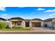 Charming front yard with a paver driveway and stone accents at 8149 E Jaeger St, Mesa, AZ 85207