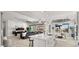 Open kitchen design with an island, stainless steel appliances and hardwood flooring at 8149 E Jaeger St, Mesa, AZ 85207