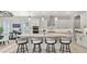 Bright kitchen featuring an oversized island, pendant lighting, and stainless-steel appliances at 8149 E Jaeger St, Mesa, AZ 85207