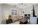 Versatile living area with neutral decor, a ceiling fan, and views of the neighborhood at 8149 E Jaeger St, Mesa, AZ 85207