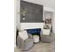 Modern living room with slate accent wall, electric fireplace, and comfortable seating at 8149 E Jaeger St, Mesa, AZ 85207