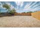 Spacious backyard with a new wooden fence and potential for customization at 832 S Drew St, Mesa, AZ 85210