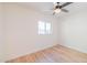 Well-lit bedroom with wood-look floors and ceiling fan offering a comfortable space at 832 S Drew St, Mesa, AZ 85210