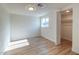 This bedroom offers new flooring, a closet, and a window at 832 S Drew St, Mesa, AZ 85210