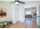 Comfortable sitting area with wood-look floors, ceiling fan, and living room visible in attached living space at 832 S Drew St, Mesa, AZ 85210