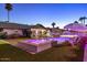 Resort-style backyard featuring a pool, spa, and lounge chairs for ultimate relaxation and entertainment at 8734 E Amelia Ave, Scottsdale, AZ 85251