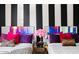 Fun bedroom featuring two beds with bright decor, and bold wallpaper at 8734 E Amelia Ave, Scottsdale, AZ 85251