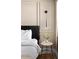 Tastefully styled bedroom featuring decorative wall trim, and a modern sconce at 8734 E Amelia Ave, Scottsdale, AZ 85251