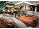 Elegant living room with open concept, stylish furniture, and decorative wallpaper at 8734 E Amelia Ave, Scottsdale, AZ 85251