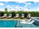 Inviting pool with in-water loungers, umbrellas, and stylish seating perfect for relaxation and entertainment at 8734 E Amelia Ave, Scottsdale, AZ 85251