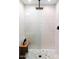 Sleek walk-in shower featuring a glass enclosure, rain shower head, and a mosaic tile floor at 8734 E Amelia Ave, Scottsdale, AZ 85251