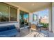 Covered patio featuring outdoor seating and views of the backyard at 10035 E Trent Ave, Mesa, AZ 85212