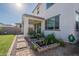 Lush backyard with artificial turf, convenient walkway, and covered patio perfect for outdoor living at 10035 E Trent Ave, Mesa, AZ 85212