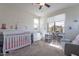 Bedroom with large windows, light colored walls, and a ceiling fan at 10035 E Trent Ave, Mesa, AZ 85212