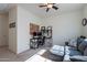 Bright home office with cozy seating area and desk with modern computer setup at 10035 E Trent Ave, Mesa, AZ 85212