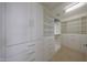 A well-organized walk-in closet with plenty of drawers and shelves at 10371 W Pontiac Dr, Peoria, AZ 85382