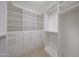A well-organized walk-in closet with plenty of shelves and racks at 10371 W Pontiac Dr, Peoria, AZ 85382