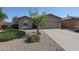 Single-story home with desert landscaping, and a two-car garage with concrete driveway at 10371 W Pontiac Dr, Peoria, AZ 85382