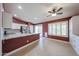 Well-equipped kitchen with granite countertops, stainless appliances, and a functional breakfast bar at 10371 W Pontiac Dr, Peoria, AZ 85382