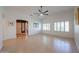 Open living space with tile flooring, vaulted ceilings, and plenty of natural light at 10371 W Pontiac Dr, Peoria, AZ 85382