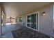 Covered patio with sliding glass doors and a colorful rug at 10371 W Pontiac Dr, Peoria, AZ 85382