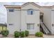 Exterior of a building with a terra cotta colored tile roof, landscaping, and multiple windows at 10401 N 52Nd St # 205, Paradise Valley, AZ 85253