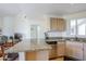 Open kitchen layout with granite countertops, breakfast bar, and stainless steel dishwasher at 10401 N 52Nd St # 205, Paradise Valley, AZ 85253