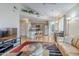 Spacious living room flowing into kitchen, featuring hardwood floors, and modern decor at 10401 N 52Nd St # 205, Paradise Valley, AZ 85253