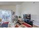 Inviting living room with TV, leading to a lovely patio with outdoor seating at 10401 N 52Nd St # 205, Paradise Valley, AZ 85253