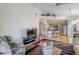 Open-concept living room seamlessly flows into the kitchen with breakfast bar seating at 10401 N 52Nd St # 205, Paradise Valley, AZ 85253