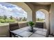 Cozy patio with table and chairs overlooking a serene landscape view and sunny sky at 10401 N 52Nd St # 205, Paradise Valley, AZ 85253