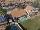 Aerial view of the home with a pool, solar panels, and well-maintained landscaping at 10733 W Clover Way, Avondale, AZ 85392