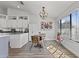 Bright kitchen and dining area featuring modern appliances, an elegant chandelier, and lots of natural light at 10733 W Clover Way, Avondale, AZ 85392