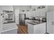 Modern kitchen with white cabinets, stainless steel appliances, and a sleek, functional design at 10733 W Clover Way, Avondale, AZ 85392