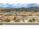 Birds eye view showing a desert community with tile roofs, desert landscaping, and solar panels at 10741 W Paso Trl, Peoria, AZ 85383
