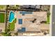 Overhead shot highlighting the roof of a home with solar panels, pool, and putting green at 10741 W Paso Trl, Peoria, AZ 85383