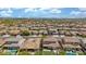 An expansive aerial shot showing a large residential community, desert landscaping, and sunny skies at 10741 W Paso Trl, Peoria, AZ 85383