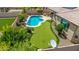 Aerial view of a private backyard with pool, putting green, and covered patio perfect for entertaining at 10741 W Paso Trl, Peoria, AZ 85383
