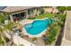 Inviting backyard oasis features a sparkling pool, putting green, and relaxing patio area at 10741 W Paso Trl, Peoria, AZ 85383