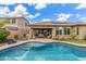Inviting backyard with a pool, covered patio, outdoor seating, and well-maintained landscaping at 10741 W Paso Trl, Peoria, AZ 85383