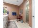 Bathroom featuring a walk-in shower with beige tiling, a makeup vanity, and neutral color scheme at 10741 W Paso Trl, Peoria, AZ 85383