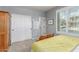 Bedroom with a yellow quilt bed, closet, and window with shutters at 10741 W Paso Trl, Peoria, AZ 85383
