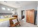 Bedroom featuring a bed, wooden wardrobe, and view into an adjoining room at 10741 W Paso Trl, Peoria, AZ 85383