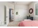 Bedroom with a decorative mirror, closet, and ensuite bathroom at 10741 W Paso Trl, Peoria, AZ 85383