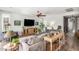 Inviting living room with a large sofa, entertainment center, and hardwood floors throughout the space at 10741 W Paso Trl, Peoria, AZ 85383