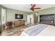 The main bedroom has a sitting area, a ceiling fan and attached ensuite bathroom at 10741 W Paso Trl, Peoria, AZ 85383
