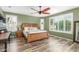 This main bedroom is spacious with a ceiling fan and plantation shutters at 10741 W Paso Trl, Peoria, AZ 85383