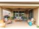 Relaxing covered patio with comfortable seating, a ceiling fan, and a view of the backyard at 10741 W Paso Trl, Peoria, AZ 85383