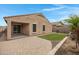 Charming backyard with artificial turf, desert landscaping, and a paved patio at 10743 W Bronco Trl, Peoria, AZ 85383